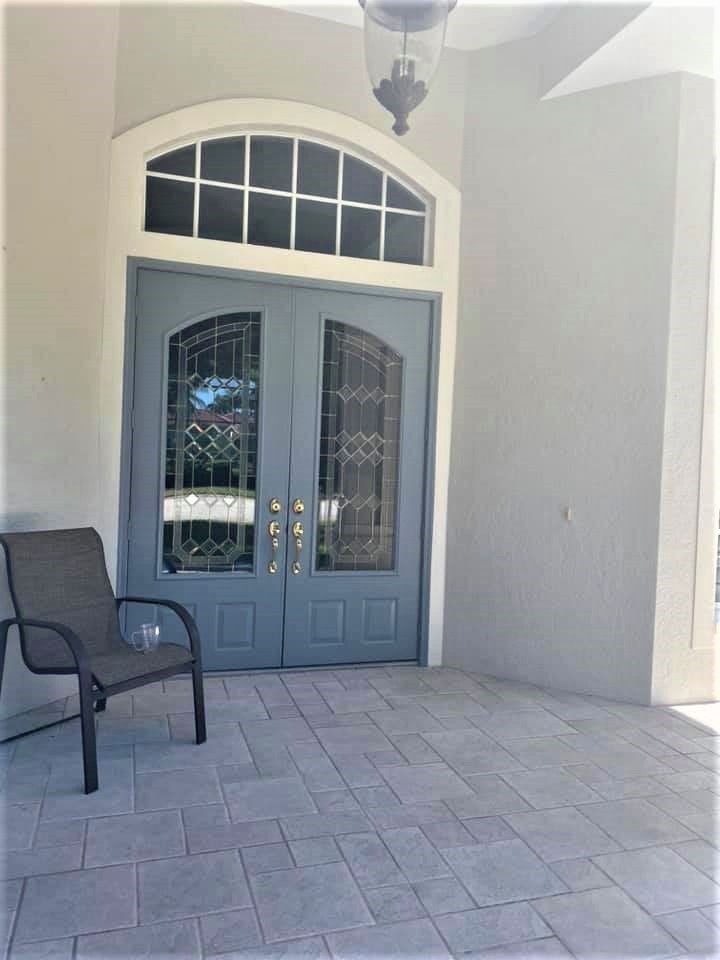Blue front door painting in Naples FL with FCI