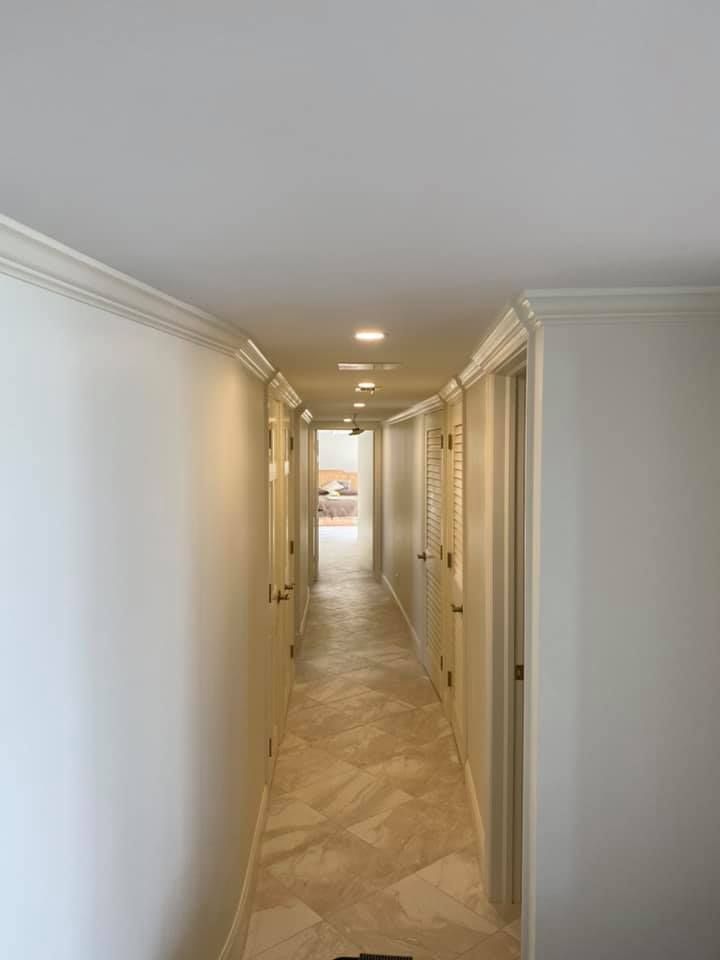 Residential interior painting work in a hallway in Naples FL