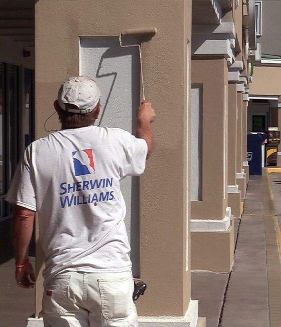 Commercial painter completing a job in a shopping strip in Naples