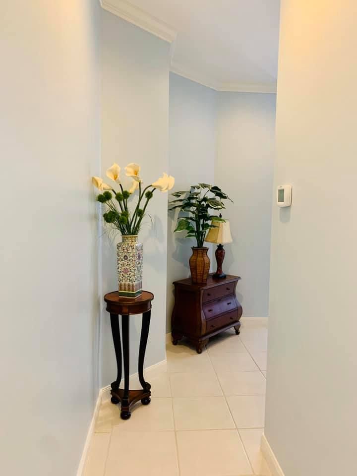 Residential interior painting work in a hallway in Naples