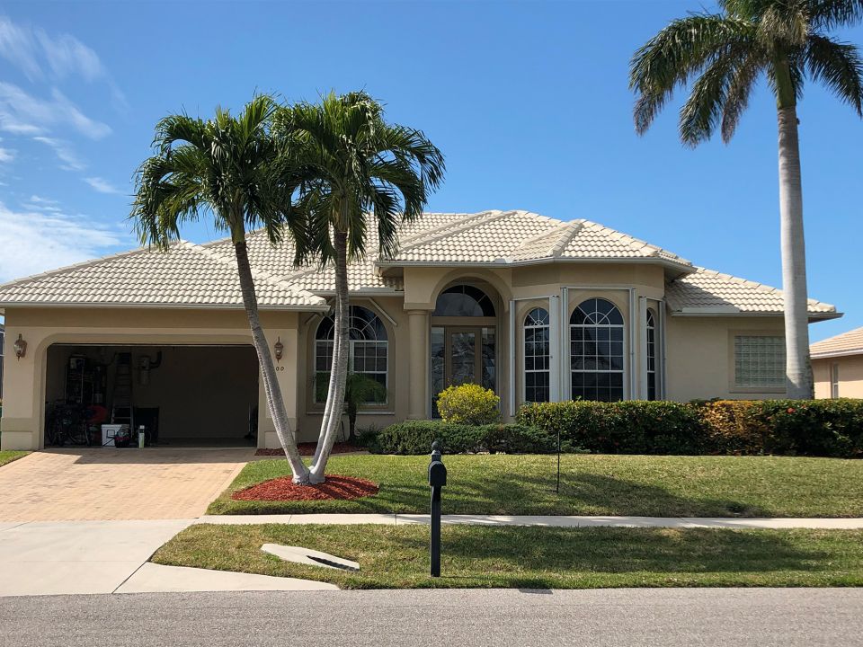 Exterior house painting done in Naples, Florida.