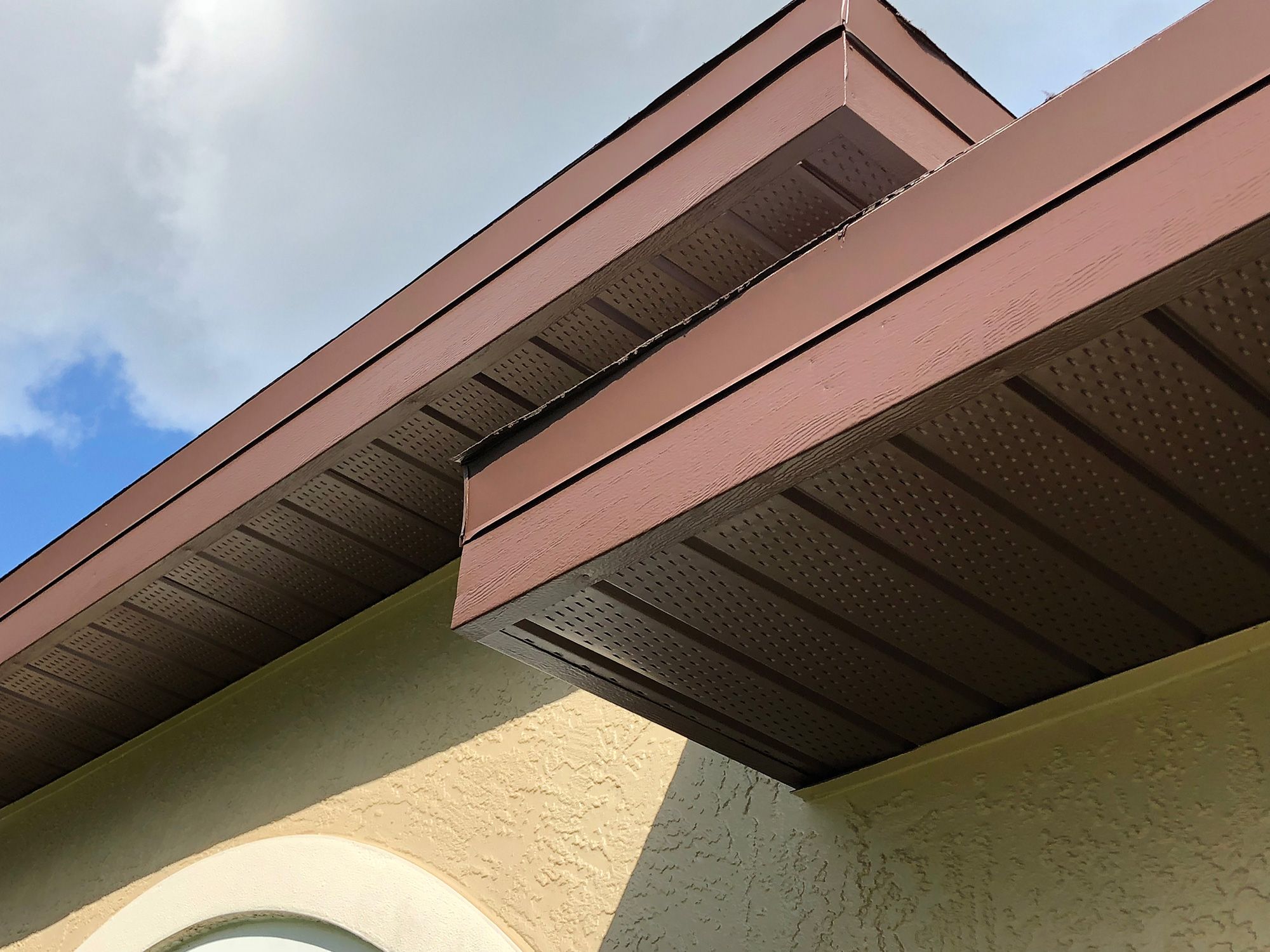 Roof soffit painting with a Naples painting company